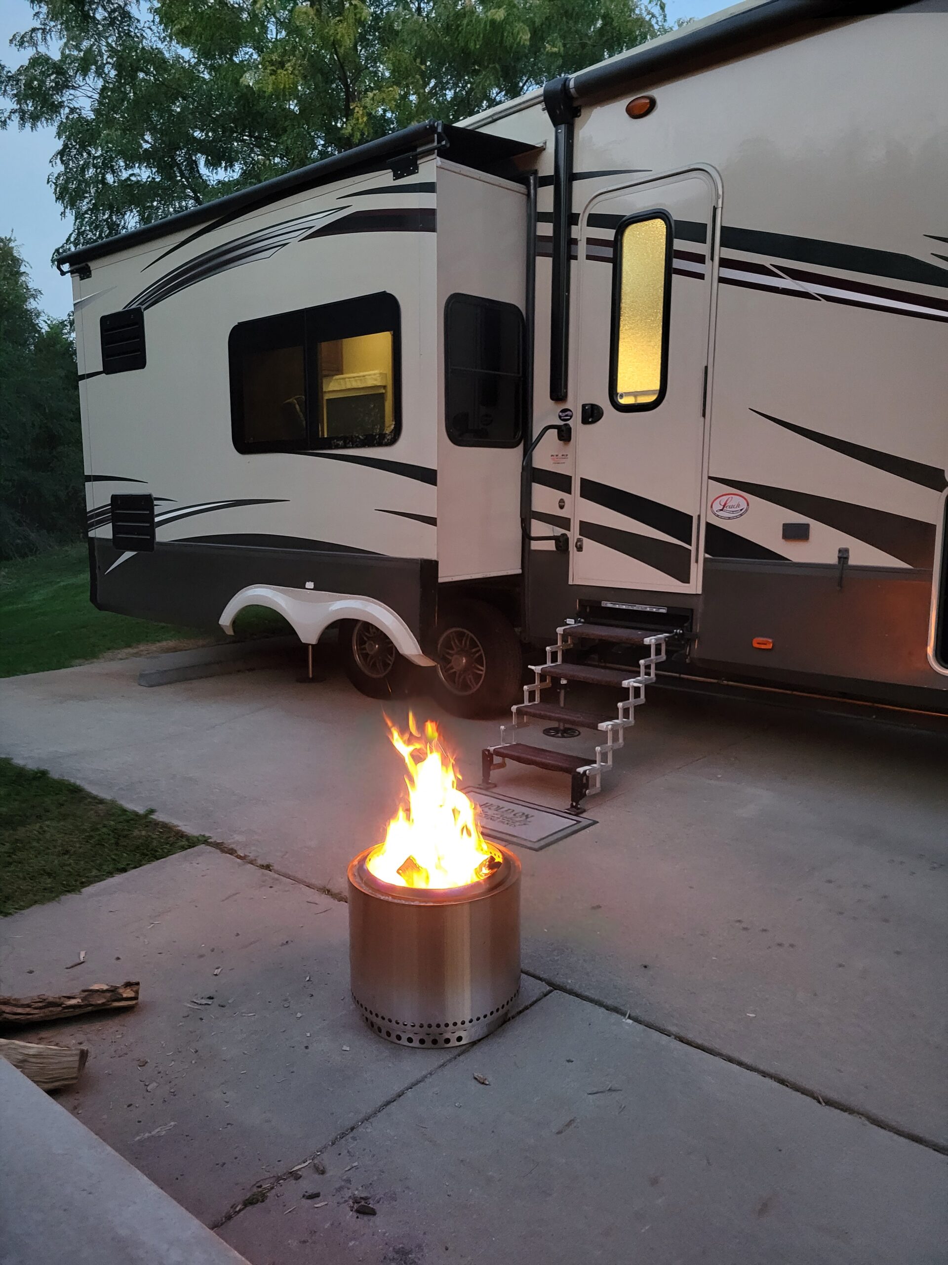 Campfire in front of RV